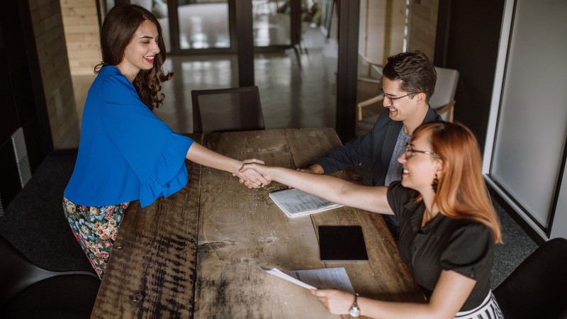 Interviewee being greeted at an interview.